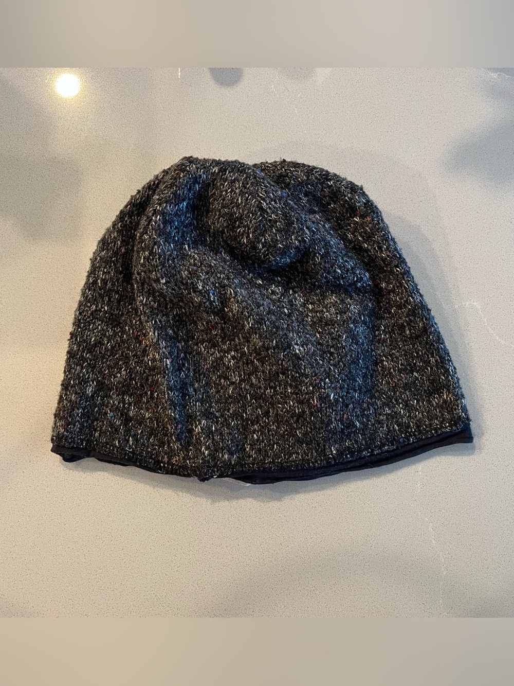 Black and gray speckled knit beanie